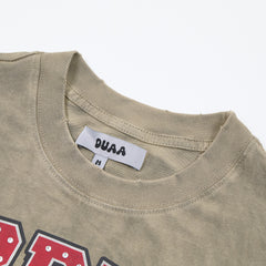 DUAA Top Duaa USA All Star Team Oversized Graphic Tee — Washed Khaki