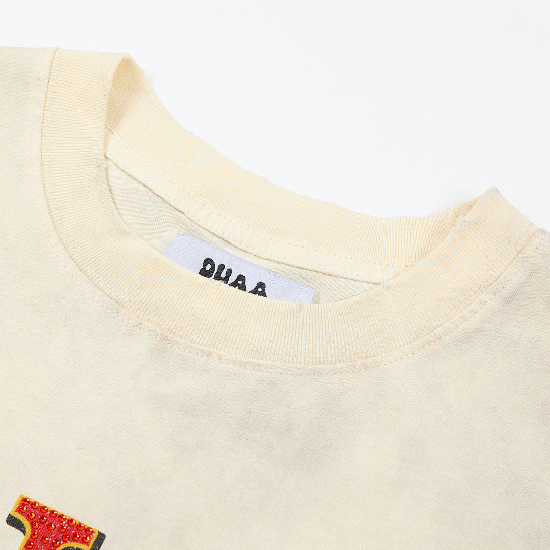 DUAA Born To Shine Oversized Graphic Tee — Cream