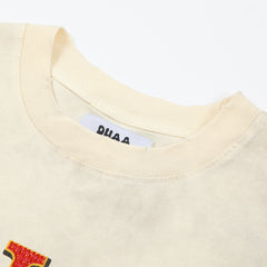 DUAA Born To Shine Oversized Graphic Tee — Cream