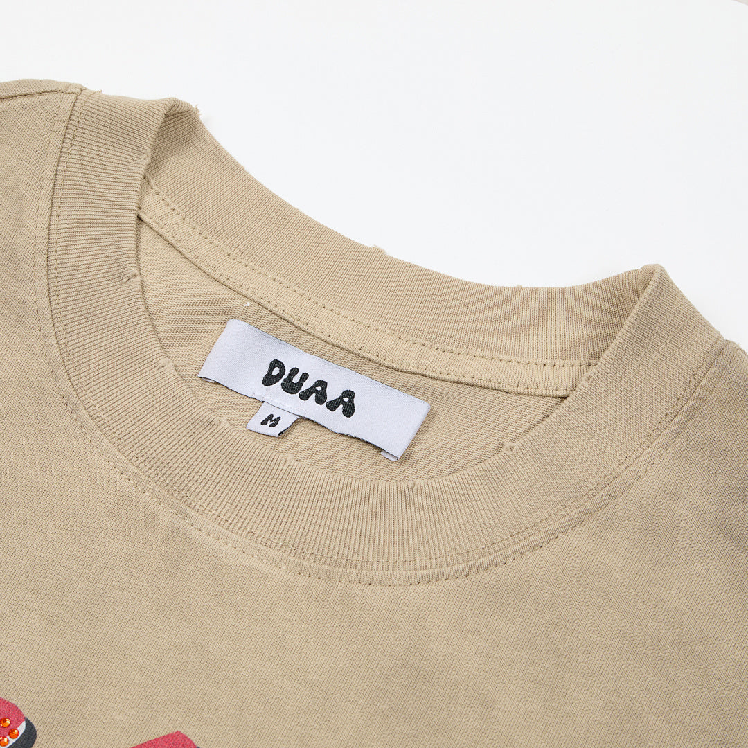 DUAA All Risk No Regrets Oversized Graphic Tee — Sand
