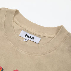 DUAA All Risk No Regrets Oversized Graphic Tee — Sand