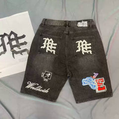 Mixed Emotion Multi‑Patch Black Denim Jorts