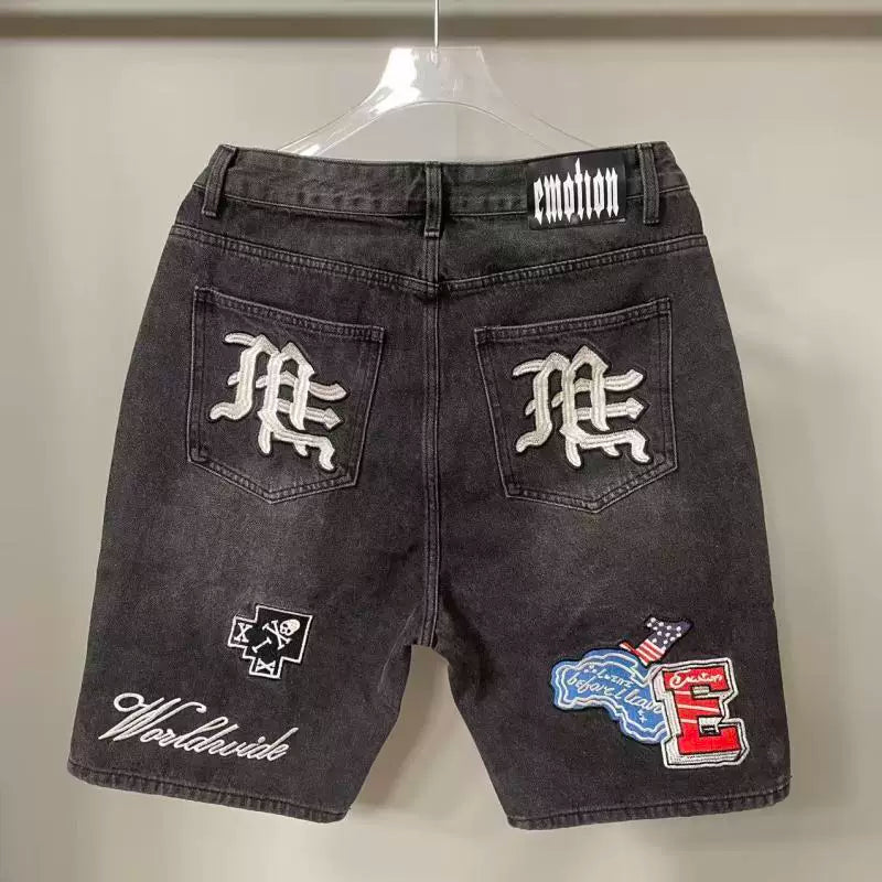 Mixed Emotion Multi‑Patch Black Denim Jorts