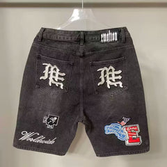 Mixed Emotion Multi‑Patch Black Denim Jorts