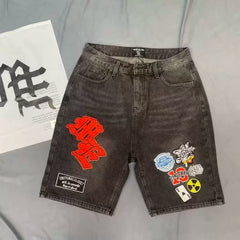 Mixed Emotion Multi‑Patch Black Denim Jorts
