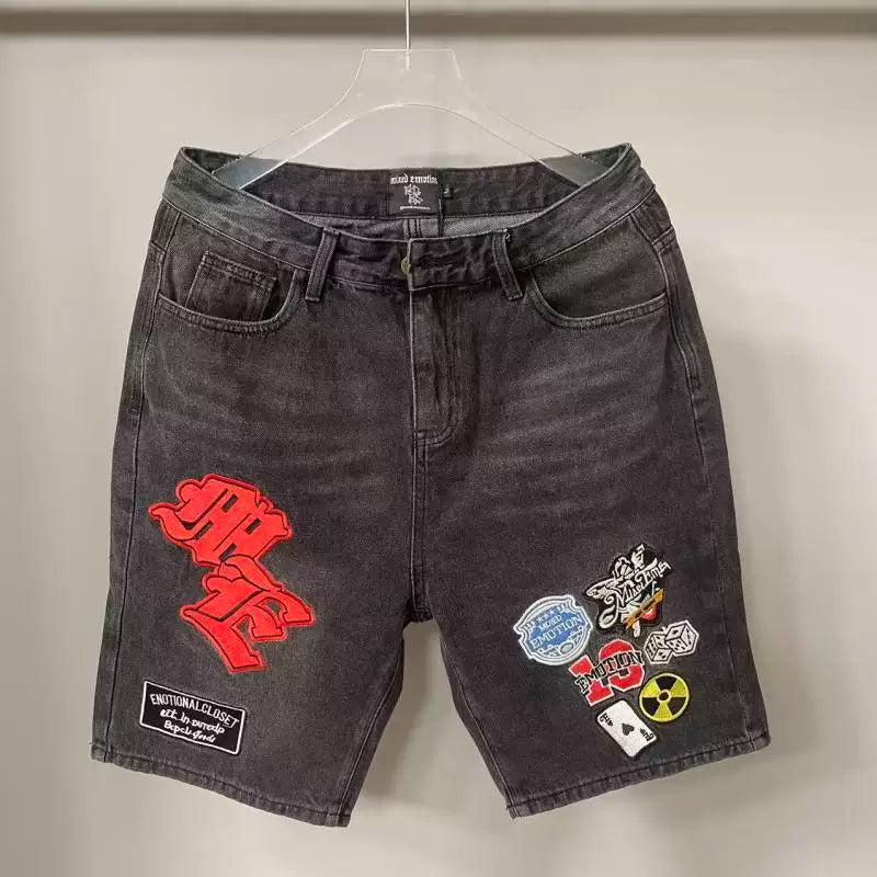 Mixed Emotion Multi‑Patch Black Denim Jorts
